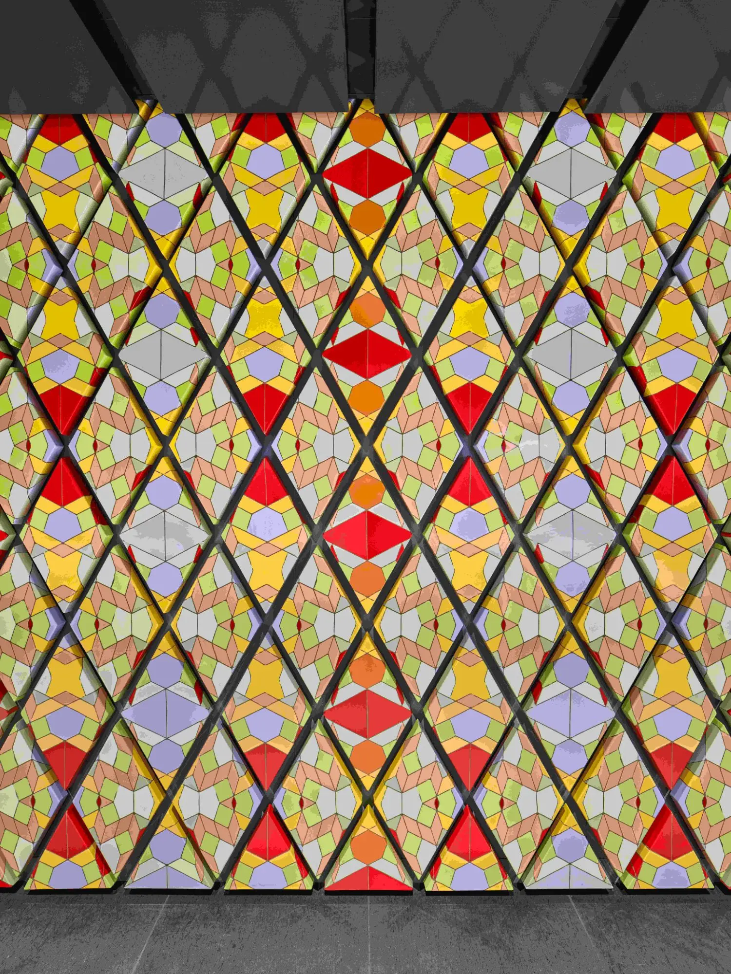 Employing blue, yellow, green, red and orange pastel tones, the artist references the traditional craftsmanship of Mexico.