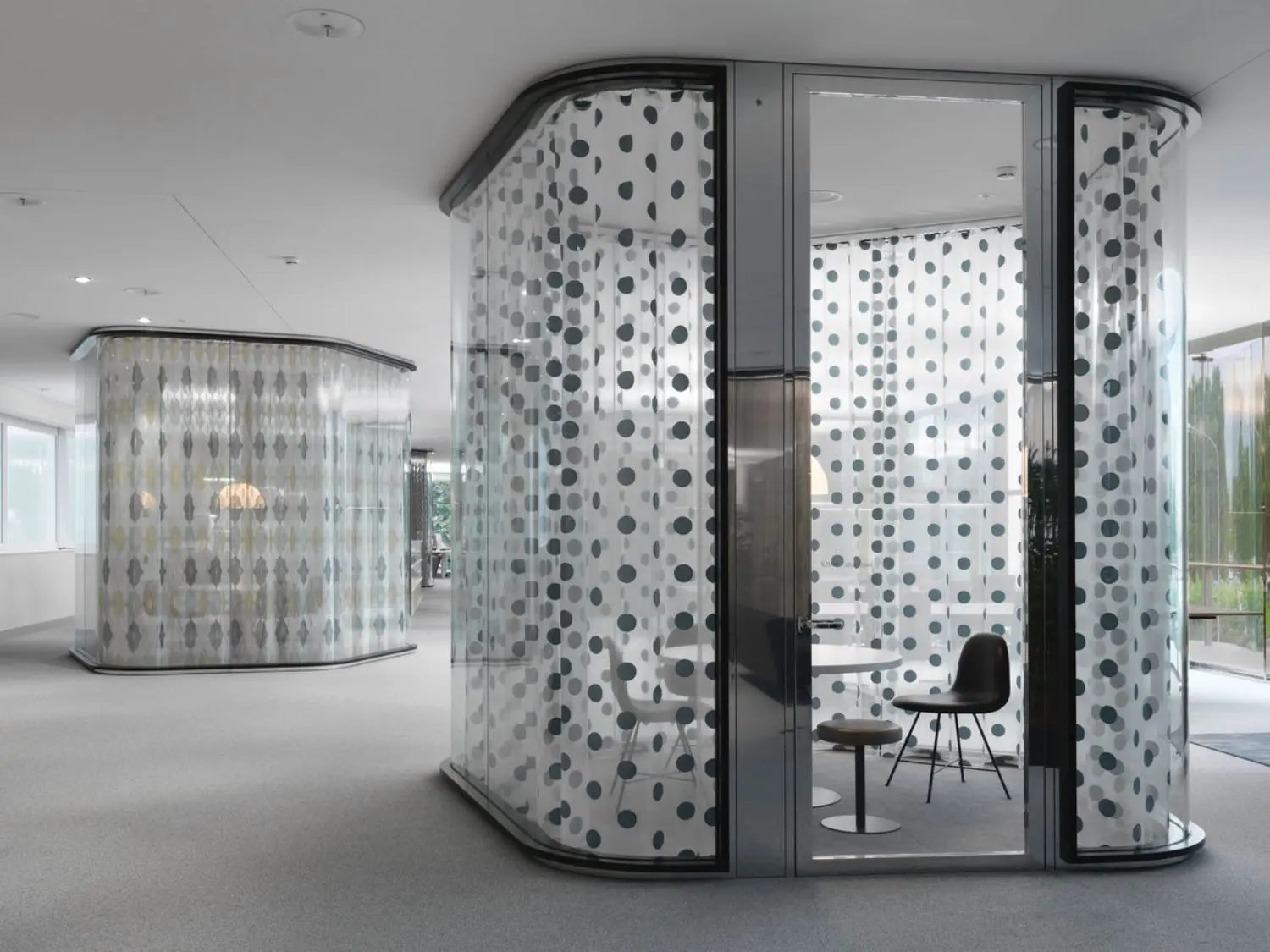 Transparent, glass-walled and with the possibility of privacy.