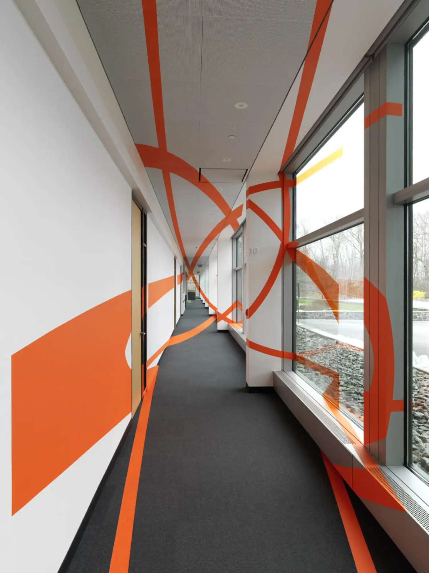 We see that the ellipses are merely marks on disparate bits of the wall and on columns of the corridor.